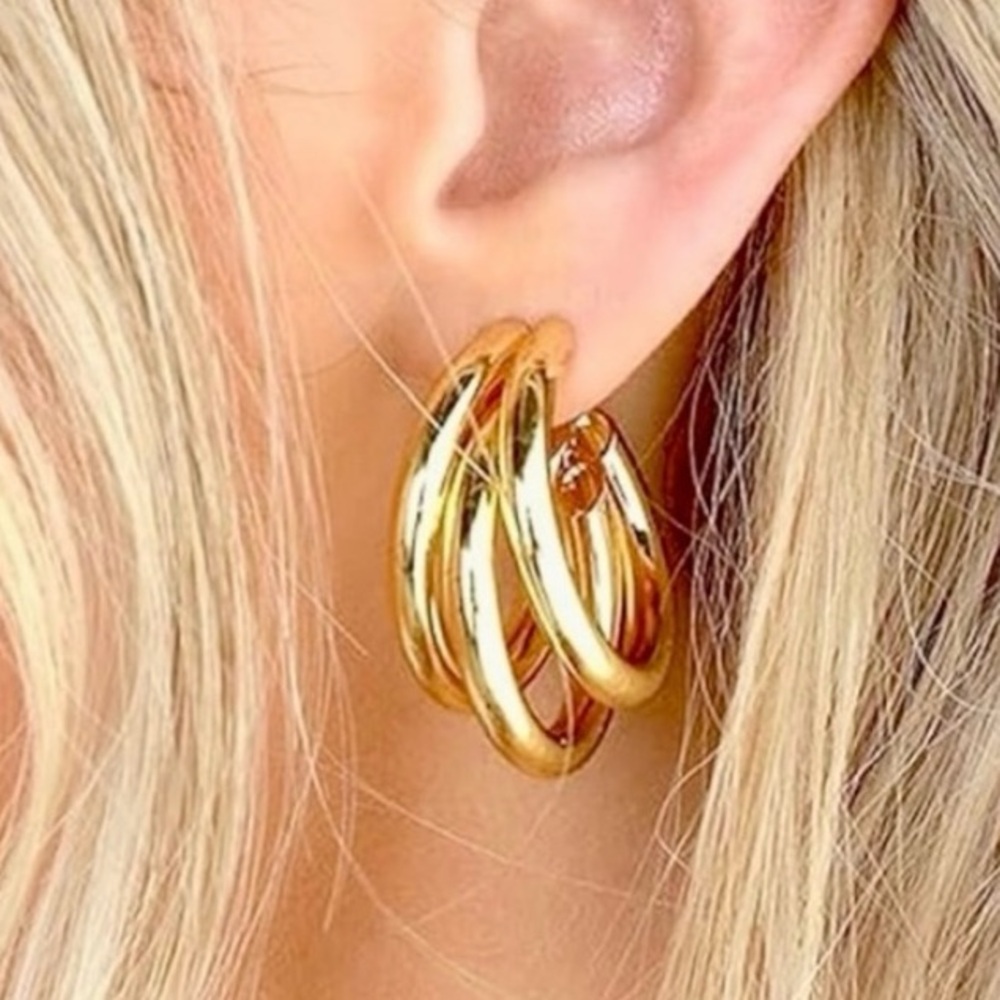 Gold tone metal triple earrings